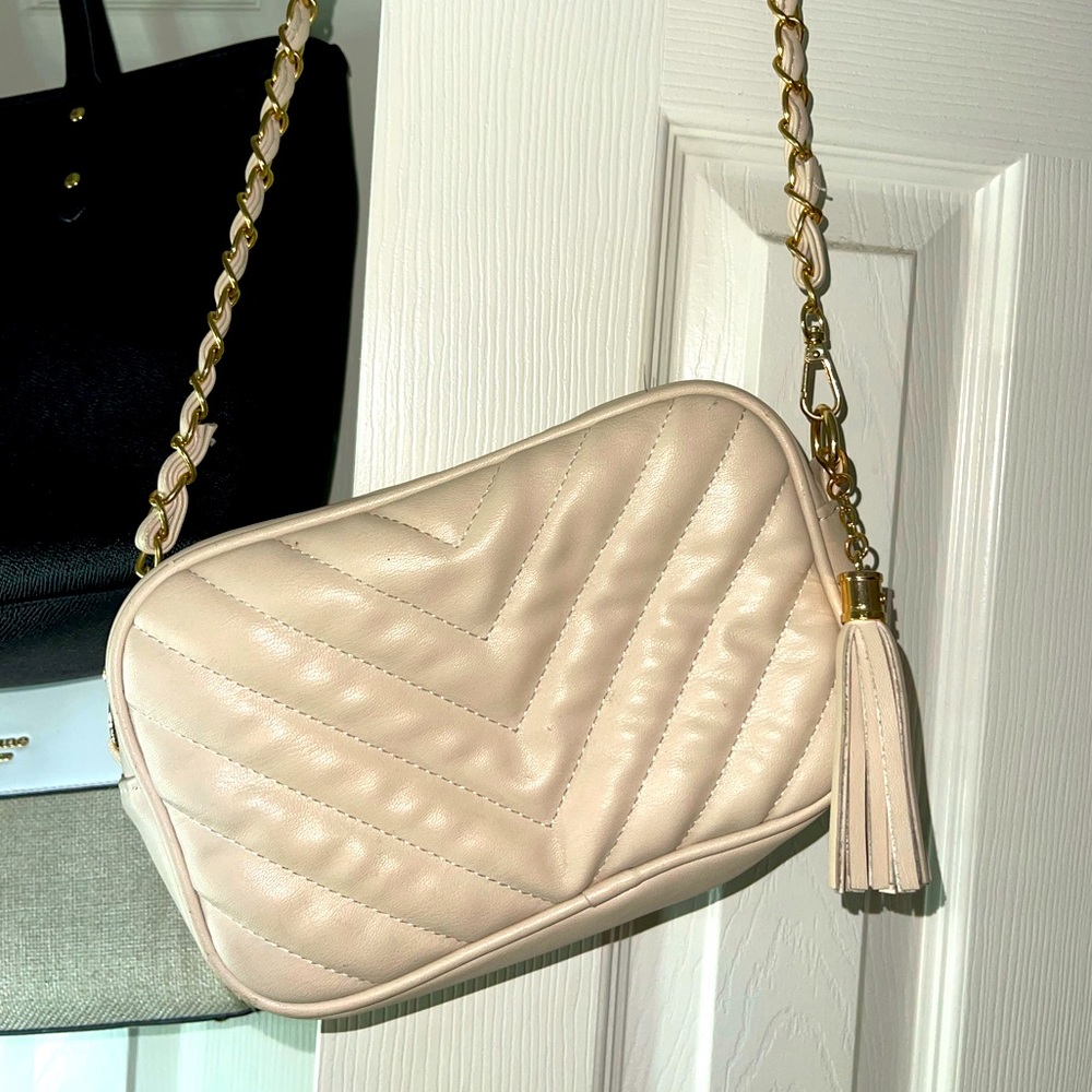 Cream crossbody bag.